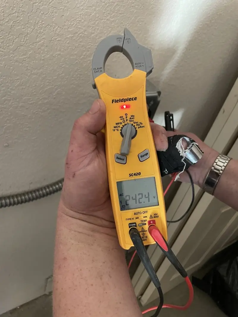 Voltage testing with clamp meter during Generator Installation in Manchester